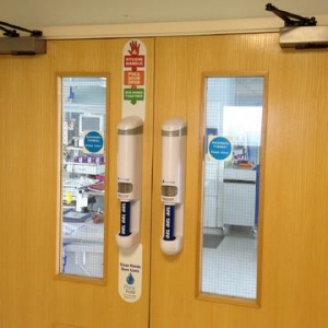 Purehold Pro Sanitising Gel Dispensing Door Handle in Use